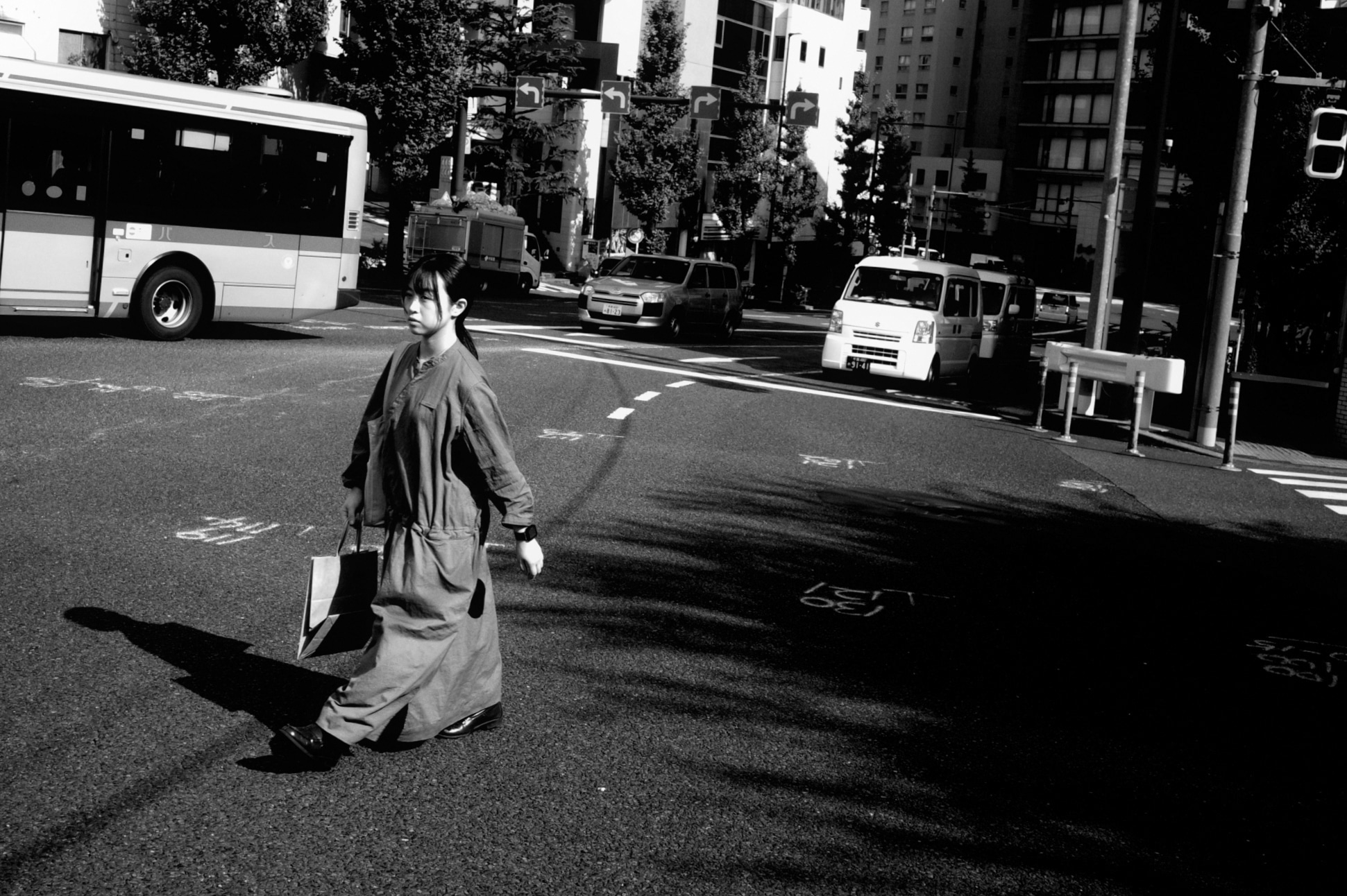A woman crossing an open city street