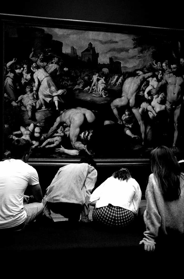 A crowd seated together indoors